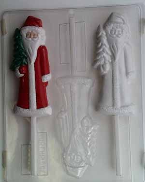 Elongated old-fashioned Santa holding a small Christmas tree C128